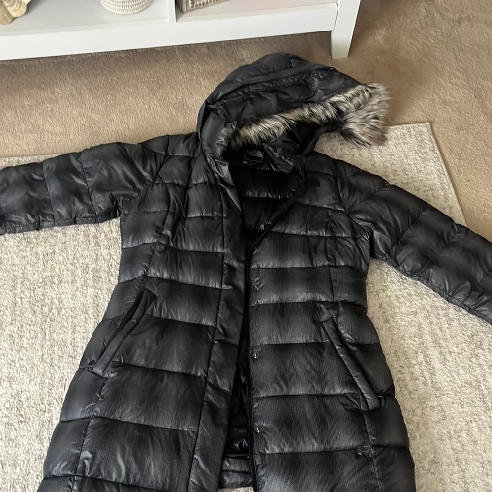 Black and gray north face puffer jacket